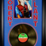 Robert Plant signed photo with gold record.